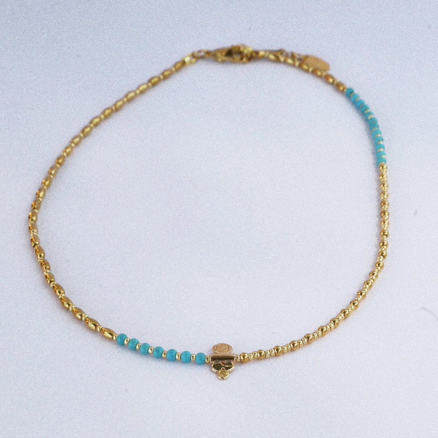 Collier “Code 27” – Perles Bleu Turquoise & Œil de Protection