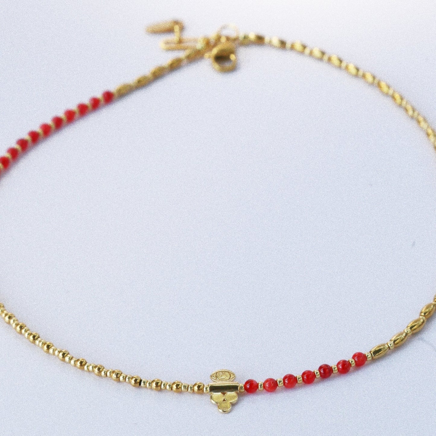 Collier “Code 27” – Nacre Rouge & Œil de Protection
